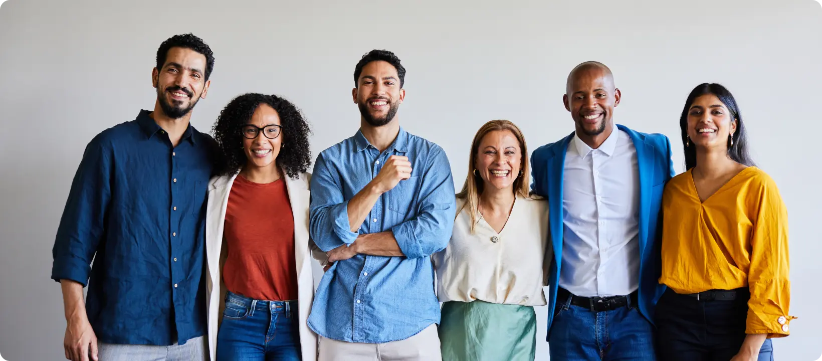 A smiling group of professionals.