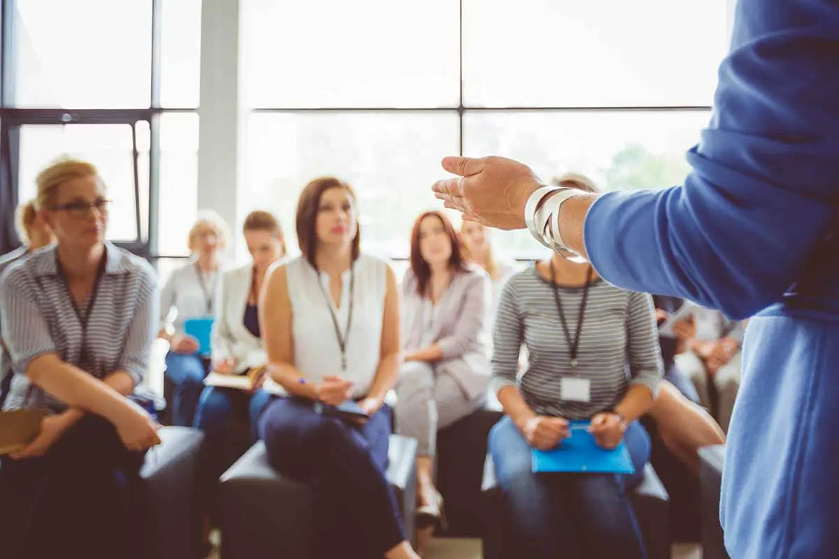 Person training group of people.