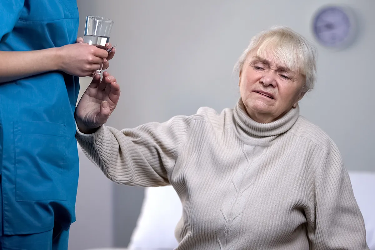 Elderly woman confronted by her nurse and mandated reporter of neglect