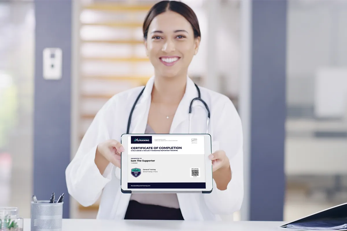 A medical professional holds up her certificate of completion that proves she completed mandated reporter training.